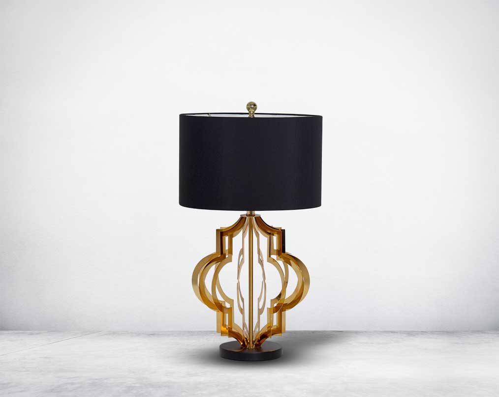 Table lamp in gold finish and marble base with front view a black fabric shade in ultra modern design.