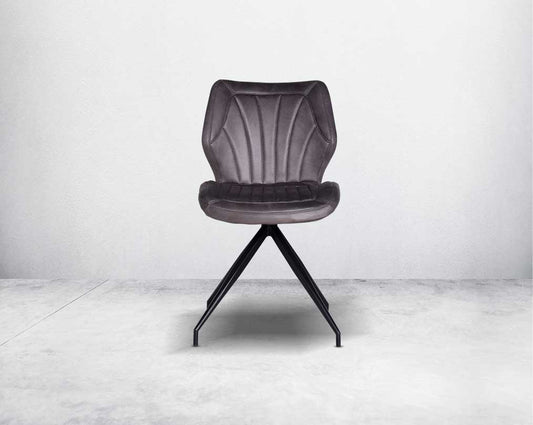 This soft, cushioned dining chair front features an extraordinary contemporary design with tufted back and cushioned seat with metal legs