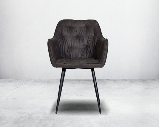 This soft, cushioned dining chair features an extraordinary contemporary design with tufted back and cushioned seat with metal legs front view