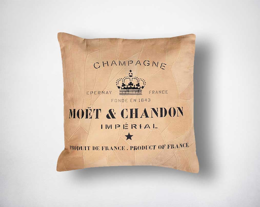 Leather cushion with black print.