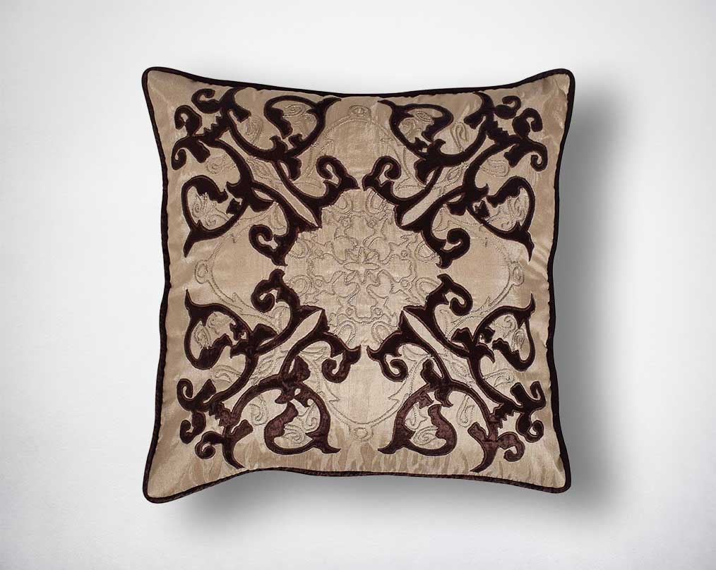 Dark brown and cream poly silk embroidered cushion.