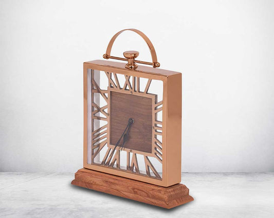 Square table clock in rose gold and wood in natural polish with side view roman numerals.