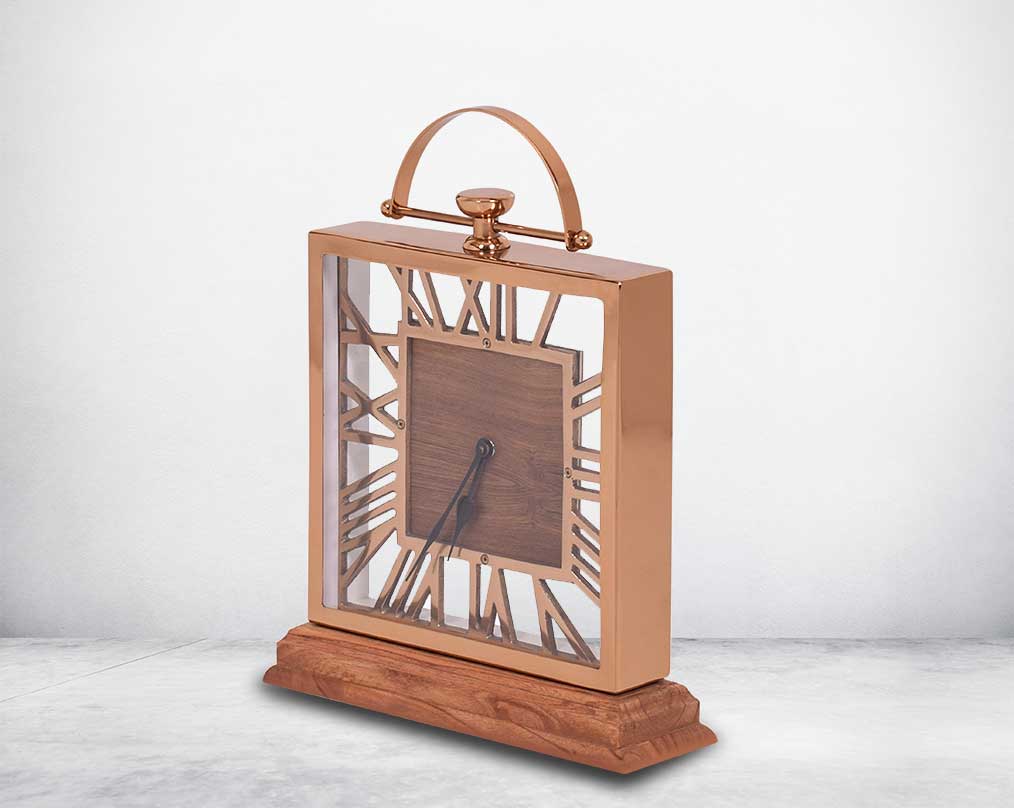Square table clock in rose gold and wood in natural polish with side view roman numerals.