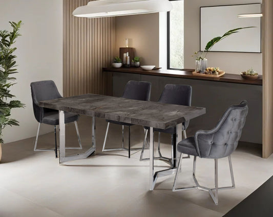 This 6-seater dining table comes with an iron grey imitation Italian marble top with a stainless steel gloss finished base in modern design his soft, cushioned dining chair features an extraordinary contemporary design with tufted back and cushioned seat