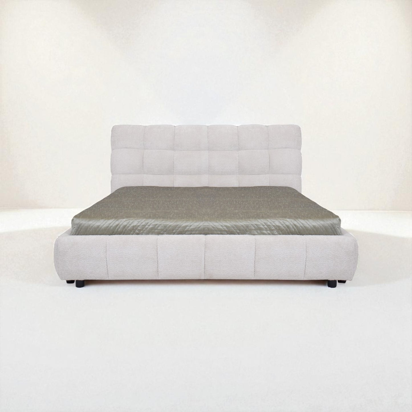 Gray upholstered bed with mattress on a white background