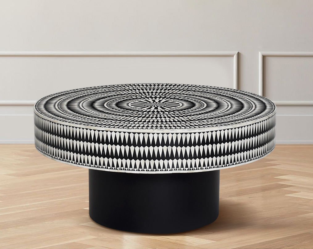 This gorgeous black and white inlay coffee table with a black metal base is a perfect statement piece in your living room.
