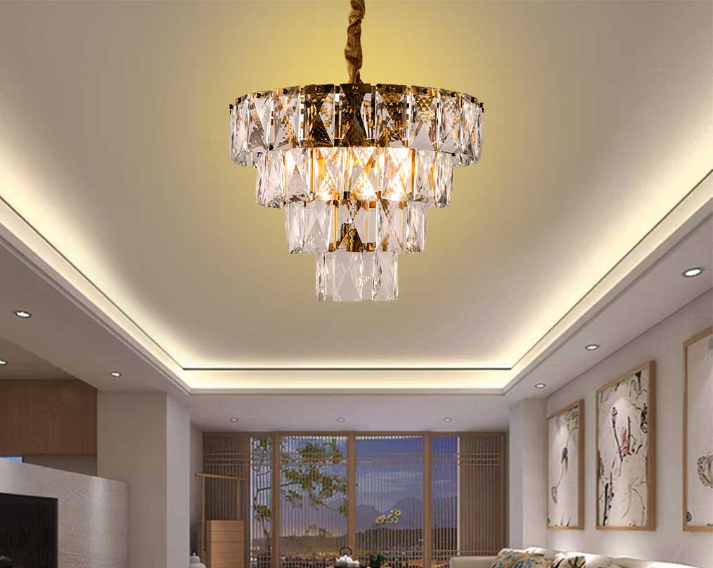 The 4-tier gold sparkling crystals drip off the brass plated round metal frame.