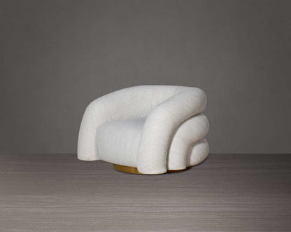 This modern chic 1 sofa in soft form upholstered in high-quality fabric crafted like soft bun with puffy rounded/ tubular back & armrest with stainless steel velvet brushed gold base is a design