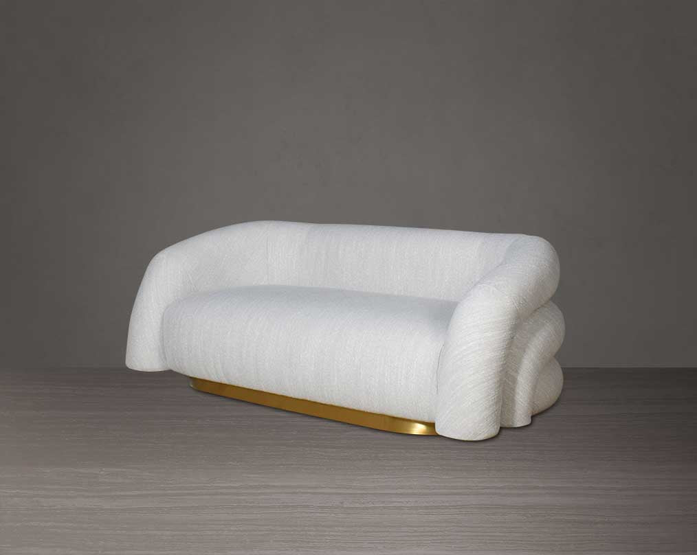 This modern chic 2 sofa in soft form upholstered in high-quality fabric crafted like soft bun with puffy rounded/ tubular back & armrest with stainless steel velvet brushed gold base is a design