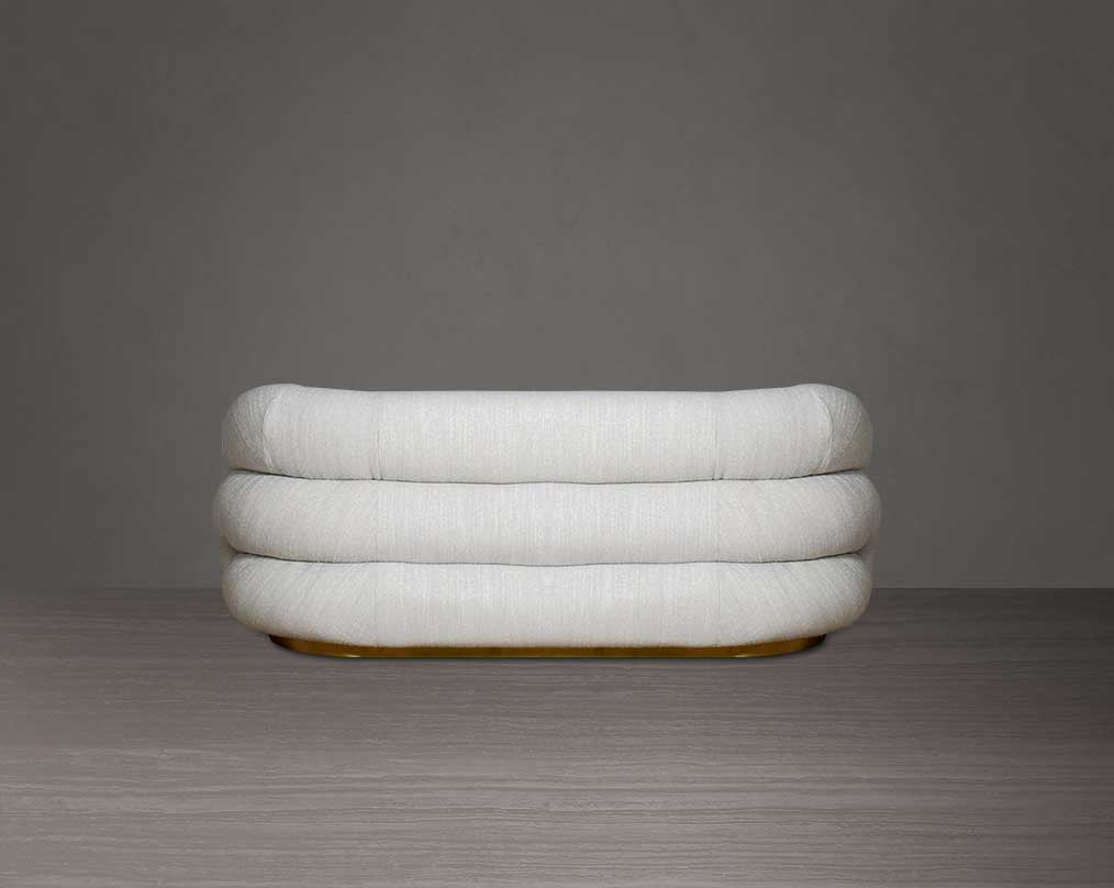 This modern chic 2  sofa back with in soft form upholstered in high-quality fabric crafted like soft bun with puffy rounded/ tubular back & armrest with stainless steel velvet brushed gold base is a design