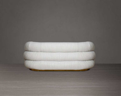 This modern chic 2  sofa back with in soft form upholstered in high-quality fabric crafted like soft bun with puffy rounded/ tubular back & armrest with stainless steel velvet brushed gold base is a design