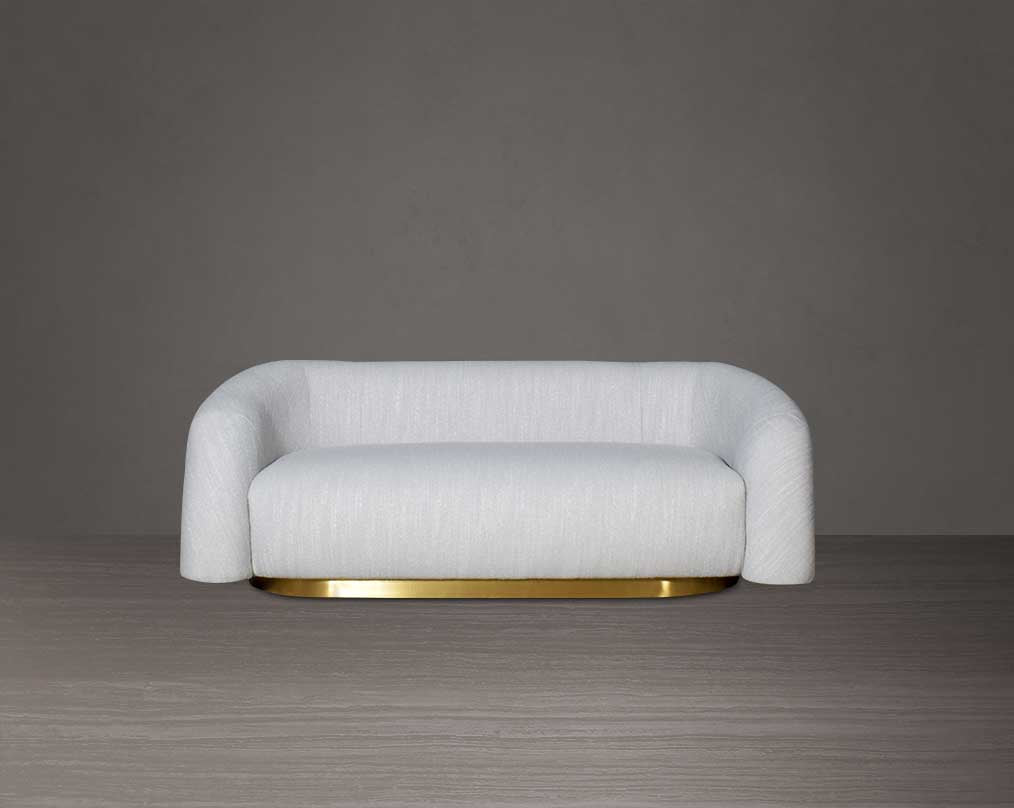 This modern chic 2 sofa in soft form upholstered in high-quality fabric crafted like soft bun with puffy rounded/ tubular back & armrest with stainless steel velvet brushed gold base is a design