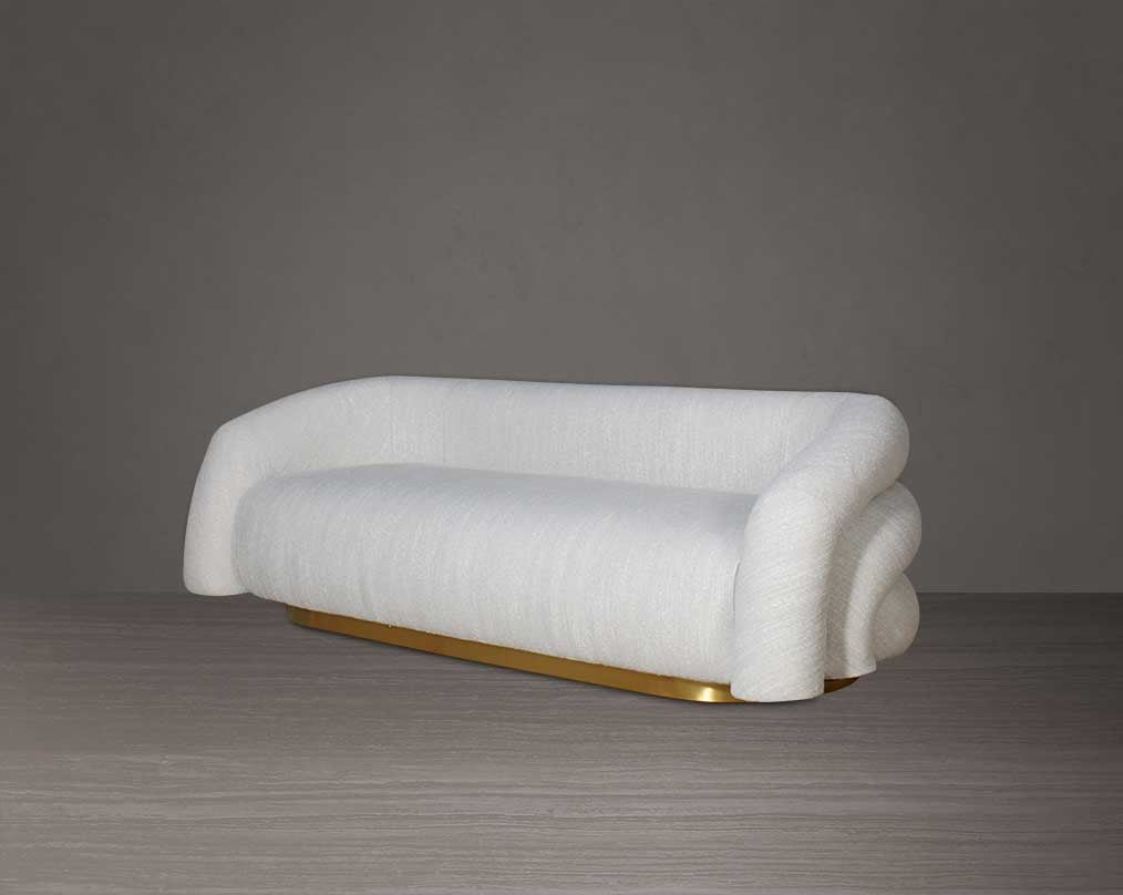 This modern chic 3 sofa in soft form upholstered in high-quality fabric crafted like soft bun with puffy rounded/ tubular back & armrest with stainless steel velvet brushed gold base is a design