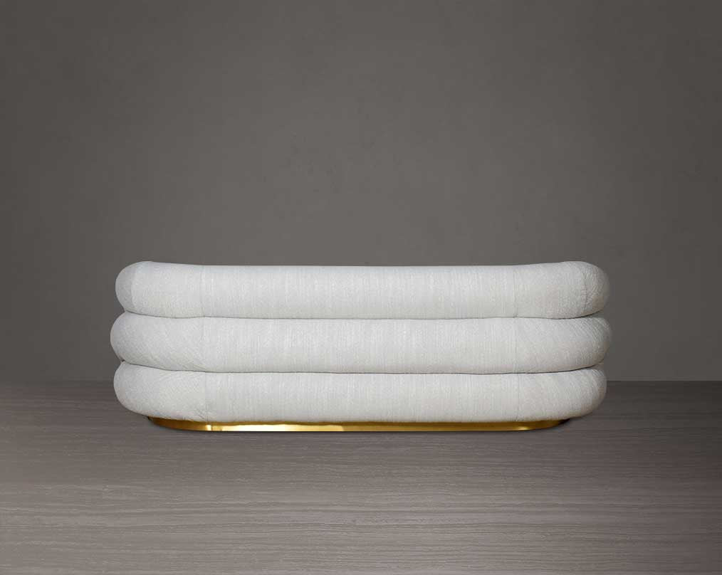 This modern chic 3  sofa back with in soft form upholstered in high-quality fabric crafted like soft bun with puffy rounded/ tubular back & armrest with stainless steel velvet brushed gold base is a design