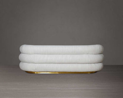 This modern chic 3  sofa back with in soft form upholstered in high-quality fabric crafted like soft bun with puffy rounded/ tubular back & armrest with stainless steel velvet brushed gold base is a design