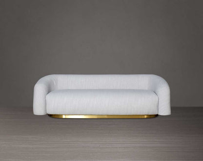 This modern chic 3 sofa in soft form upholstered in high-quality fabric crafted like soft bun with puffy rounded/ tubular back & armrest with stainless steel velvet brushed gold base is a design