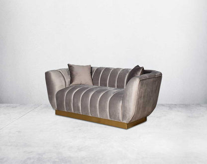 This gorgeous neo-classic 2  seater sofa is upholstered in high-quality velvet fabric with a vertical quilted backrest that accentuates simplicity and comes with 6 beautiful cushions to compliment.