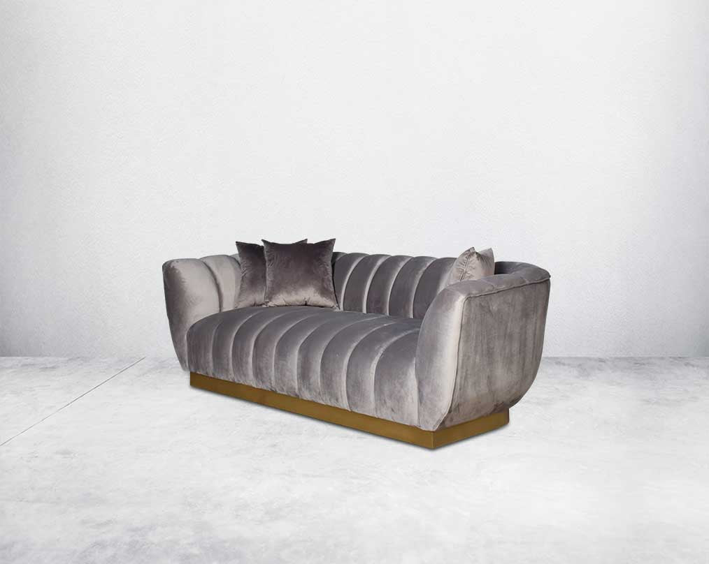 This gorgeous neo-classic 3 seater sofa is upholstered in high-quality velvet fabric with a vertical quilted backrest that accentuates simplicity and comes with 6 beautiful cushions to compliment.