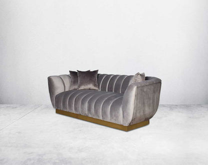 This gorgeous neo-classic 3 seater sofa is upholstered in high-quality velvet fabric with a vertical quilted backrest that accentuates simplicity and comes with 6 beautiful cushions to compliment.