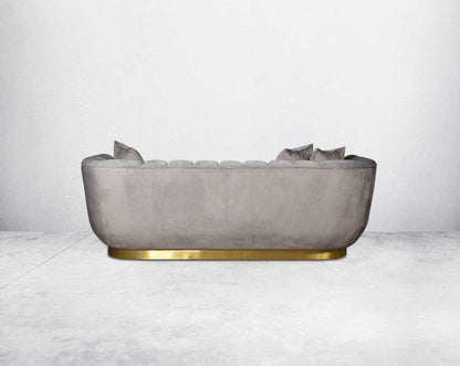 This gorgeous neo-classic 3 seater  back sofa is upholstered in high-quality velvet fabric with a vertical quilted backrest that accentuates simplicity and comes with 6 beautiful cushions to compliment. 