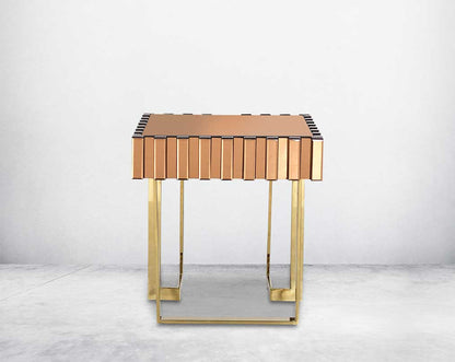End table in gold mirror with gold plated stainless steel base. The table has one drawer.