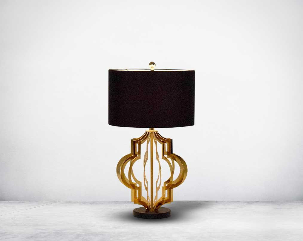 Table lamp in gold finish and marble base with a black fabric shade in ultra modern design.