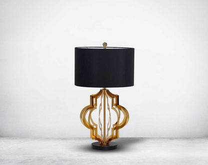 Table lamp in gold finish and marble base with front view  a black fabric shade in ultra modern design.