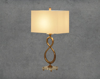 Table lamp in decorative metal and crystal base with translucent fabric shade