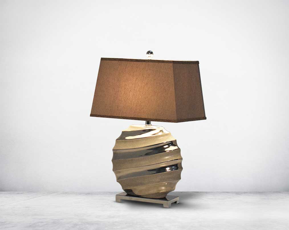 Brown  table lamp in ceramic with metal base & translucent fabric shade.