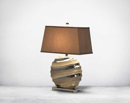 Brown  table lamp in ceramic with metal base & translucent fabric shade.