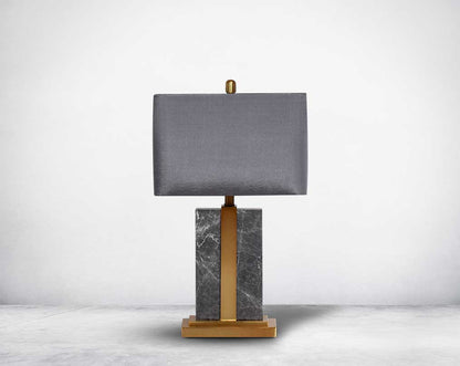 Table lamp with marble & metal base with translucent fabric shade in ultra modern design.
