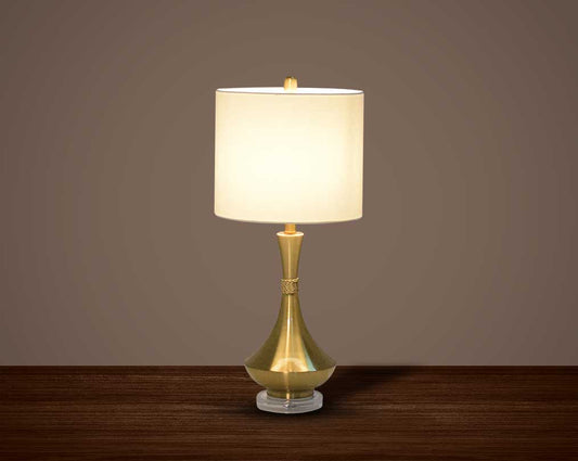 Table lamp in metallic gold and crystal with translucent fabric shade.