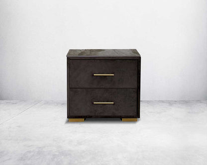 The bedside table comes with a fully upholstered and grey marble top with closed 2 drawers with matt gold base & handles in modern classic design.
