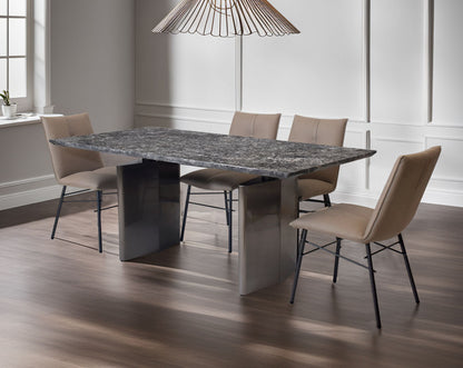 This dining chair is crafted in faux leather with matt black metal legs. It is sleek and modern in design with dining table