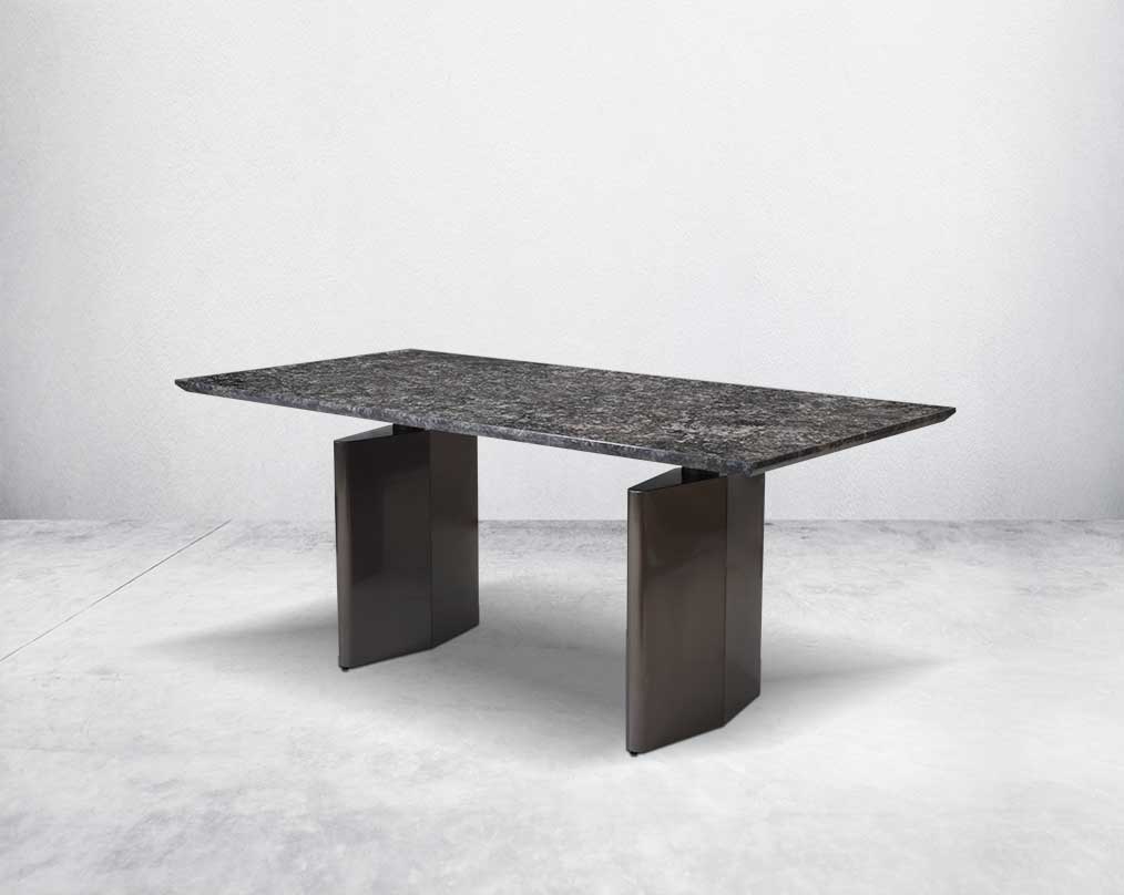 This 6 & 8 seater minimalistically designed dining table with grey marble top is an embodiment of contemporary chicness. This dining table in geometrical hexagonal base comes in glossy gunmetal finish in a contemporary design.