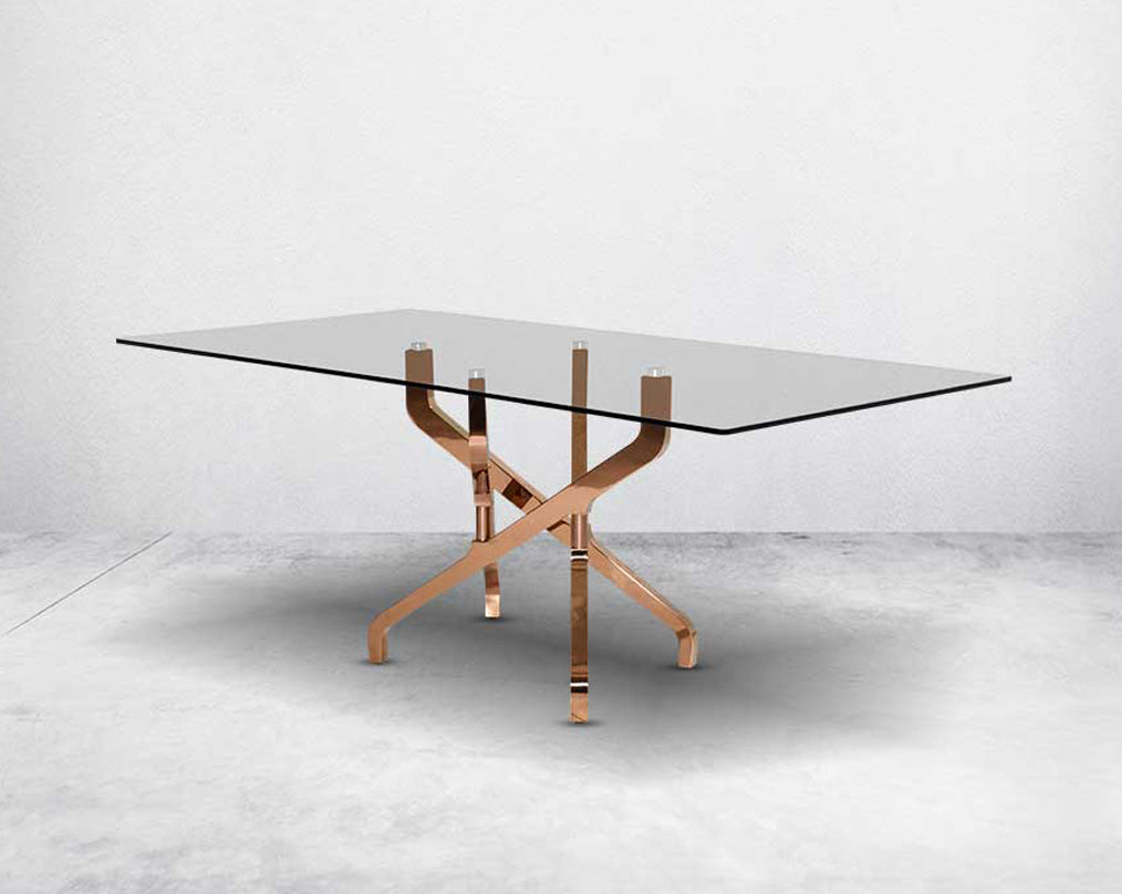 This chic 6 seater rectangular dining table with tempered glass table top which creates a striking contrast with shiny rose gold plated criss cross stainless steel base in rich contemporary design.