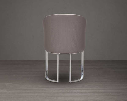 This dining chair back with stands resplendent with a rich contemporary look. It is crafted in faux leather upholstery and comes in two colours with glossy, silver-plated, stainless steel legs