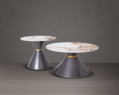 This round coffee table is a captivating composition of a round white & brown ceramic top & conical metal base