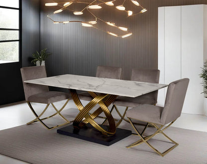 This voguish 6 seater rectangular dining table is cast with Dining chair upholstered in fabric with gold-plated stainless steel legs in a cross design.