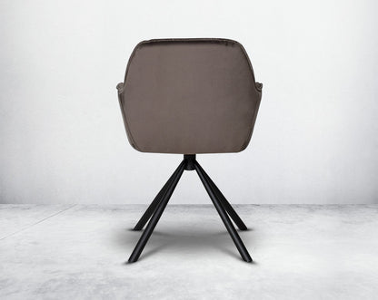 This soft, cushioned dining chair back with features an extraordinary contemporary design with tufted back and cushioned seat with metal legs.It is upholstered in velvet fabric which will certainly elevate the style of your space.