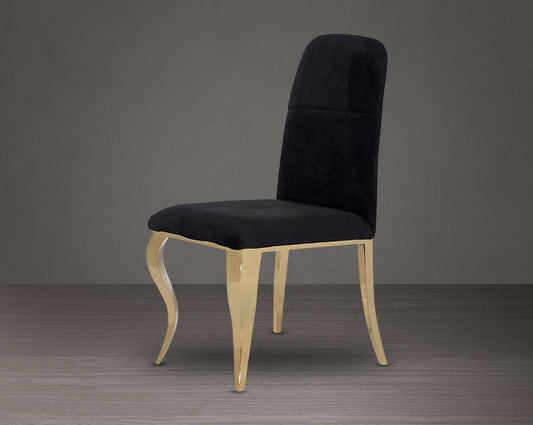 Dining chair upholstered in fabric with gold plated stainless steel legs.