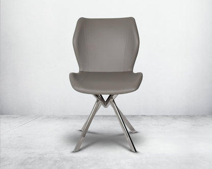 Dining chair upholstered in faux leather with stainless steel legs front view