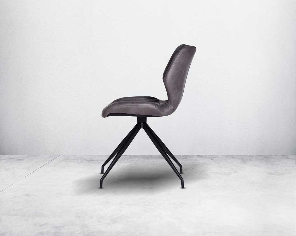 This soft, cushioned dining chair features an extraordinary contemporary design with tufted back and cushioned seat with metal legs