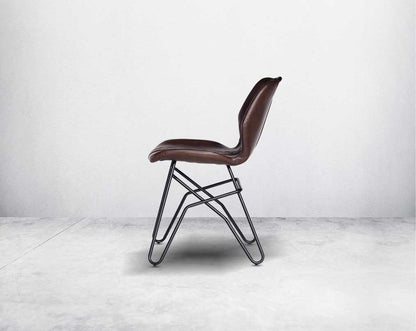 This soft, cushioned dining chair features an extraordinary contemporary design with tufted back and cushioned seat with metal legs