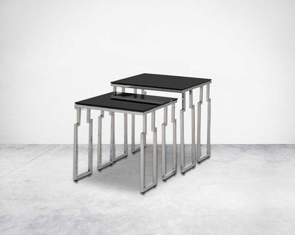 Nested tables in a set of 2 with black tempered glass top and high polished stainless steel base in rich contemporary design side view