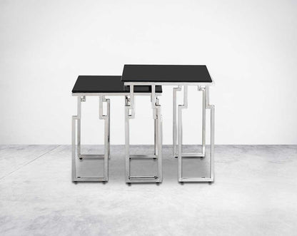 Nested tables in a set of 2 with black tempered glass top and high polished stainless steel base in rich contemporary design front view