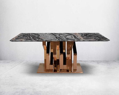 Glorious 8-seater black marble top dining table with a glossy rose gold stainless steel base with front view.
