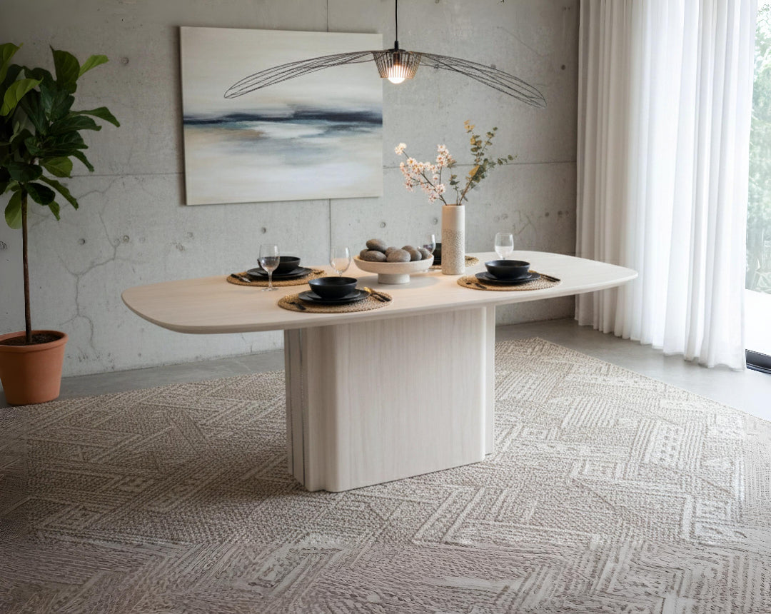 Modern dining table set in a stylish room with decor elements.