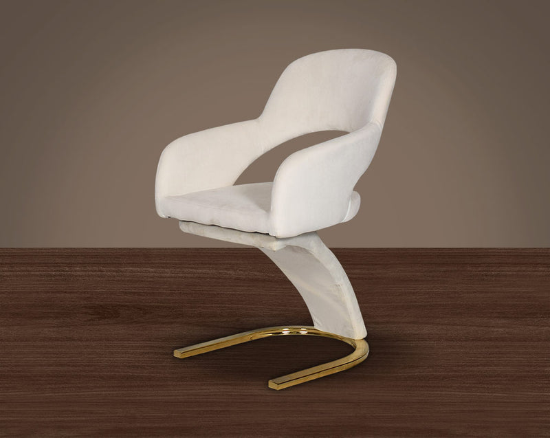 This dining chair features an extraordinary design with a backrest and a cushioned seat upholstered in velvet. It has a horseshoe motif gold plated metal base which adds a modern glamorous look to any space