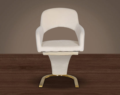 This dining chair features an extraordinary design with a backrest and a cushioned seat upholstered in velvet. It has a horseshoe motif gold plated metal base which adds a modern glamorous look to any space